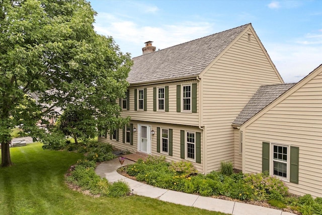 10800 N Norway Dr, Mequon, WI 53092 - view of front of property with a chimney and a front yard