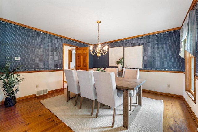 10800 N Norway Dr, Mequon, WI 53092 - dining room with a chandelier, ornamental molding, and wood-type flooring