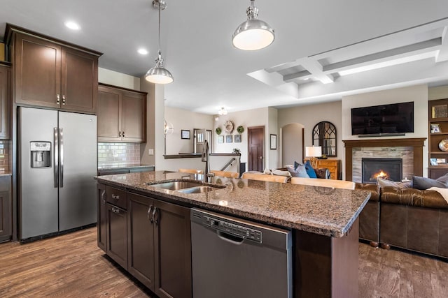 2210 Stoney Brook Dr, Manitowoc, WI 54220 - kitchen with appliances with stainless steel finishes, dark wood-style floors, dark stone counters, recessed lighting, and coffered ceiling