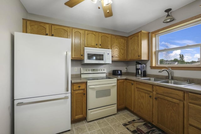 W5355 Linden Hill Dr, Appleton, WI 54915 - kitchen featuring white appliances, brown cabinets, a ceiling fan, and light countertops