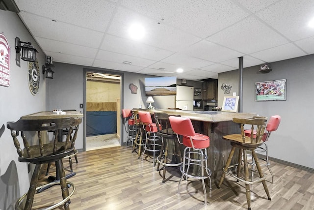 W5355 Linden Hill Dr, Appleton, WI 54915 - indoor dry bar featuring freestanding refrigerator, wood finished floors, and a paneled ceiling