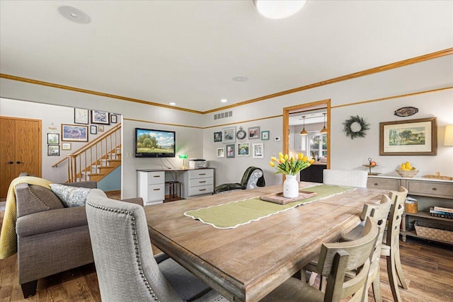 1021 Aspen Pl, West Bend, WI 53095 - dining area featuring stairs, ornamental molding, and wood finished floors