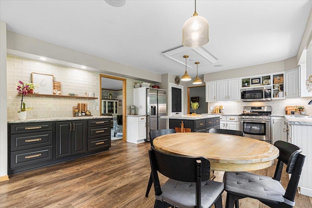 1021 Aspen Pl, West Bend, WI 53095 - dining area with dark wood-type flooring