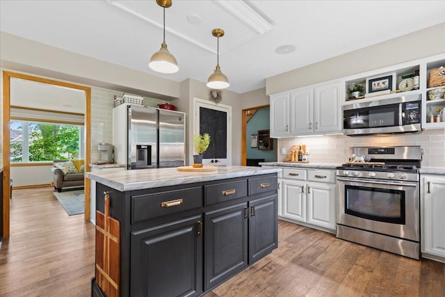1021 Aspen Pl, West Bend, WI 53095 - kitchen featuring appliances with stainless steel finishes, white cabinetry, and open shelves