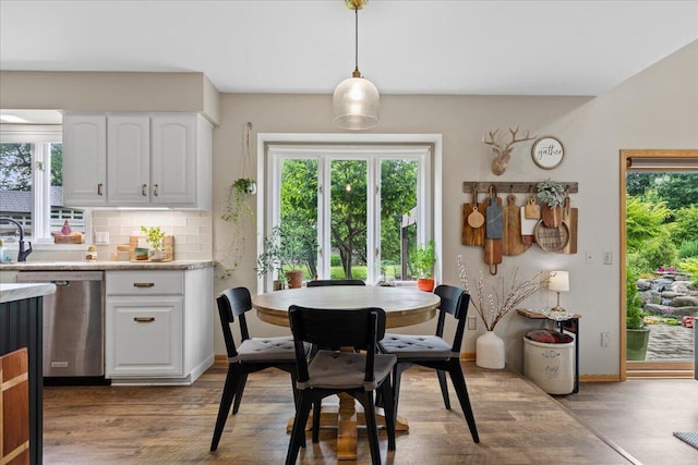 1021 Aspen Pl, West Bend, WI 53095 - dining space with wood finished floors