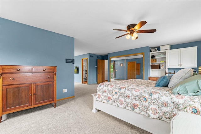 1021 Aspen Pl, West Bend, WI 53095 - bedroom with light colored carpet, a closet, and a ceiling fan