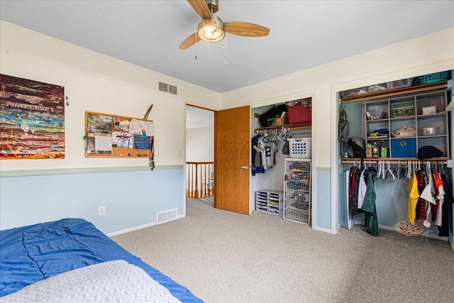 1021 Aspen Pl, West Bend, WI 53095 - bedroom with two closets, carpet, and ceiling fan