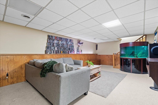 1021 Aspen Pl, West Bend, WI 53095 - living area featuring wainscoting, carpet, wood walls, and a drop ceiling
