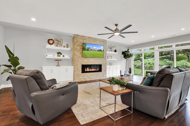 742 Charolais Dr, Slinger, WI 53086 - living area featuring a fireplace, a ceiling fan, dark wood-style floors, and recessed lighting