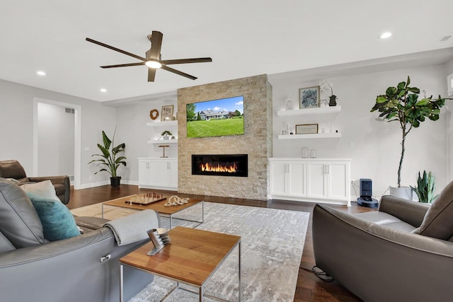 742 Charolais Dr, Slinger, WI 53086 - living room with dark wood-style flooring, a ceiling fan, recessed lighting, a fireplace, and built in shelves