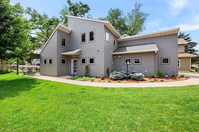2830 Tomahawk Ct, Middleton, WI 53562 - view of front of property featuring a front yard, a shingled roof, and a patio area