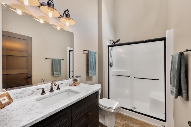 2830 Tomahawk Ct, Middleton, WI 53562 - full bath with vanity, a stall shower, and wood finished floors