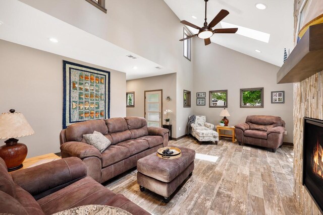 2830 Tomahawk Ct, Middleton, WI 53562 - living area with a ceiling fan, high vaulted ceiling, light wood-style floors, a skylight, and recessed lighting