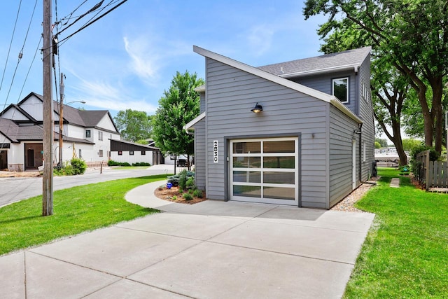 2830 Tomahawk Ct, Middleton, WI 53562 - view of home's exterior with a lawn, a garage, driveway, and roof with shingles
