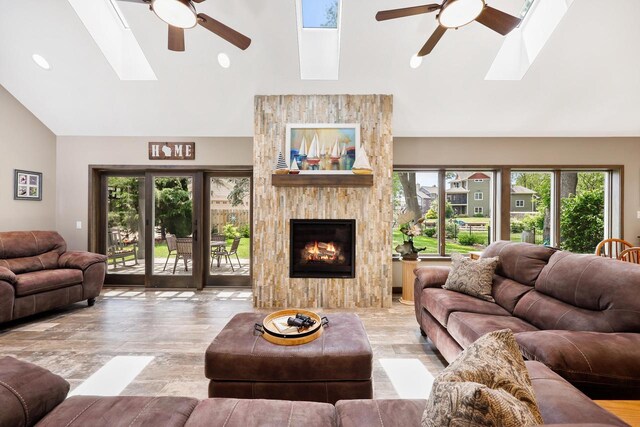 2830 Tomahawk Ct, Middleton, WI 53562 - living area with a skylight, ceiling fan, high vaulted ceiling, and plenty of natural light