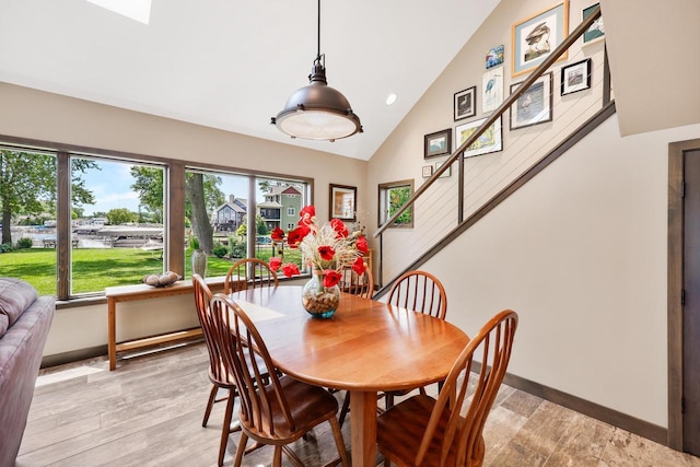 2830 Tomahawk Ct, Middleton, WI 53562 - dining space with high vaulted ceiling, recessed lighting, and stairway