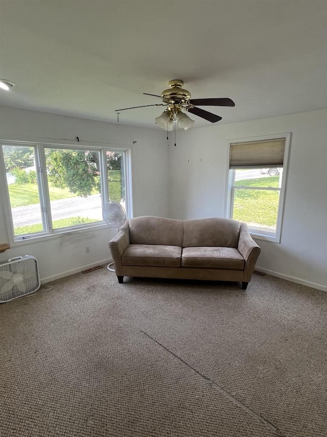 530 Wisconsin St, Columbus, WI 53925 - carpeted living area with baseboards and ceiling fan