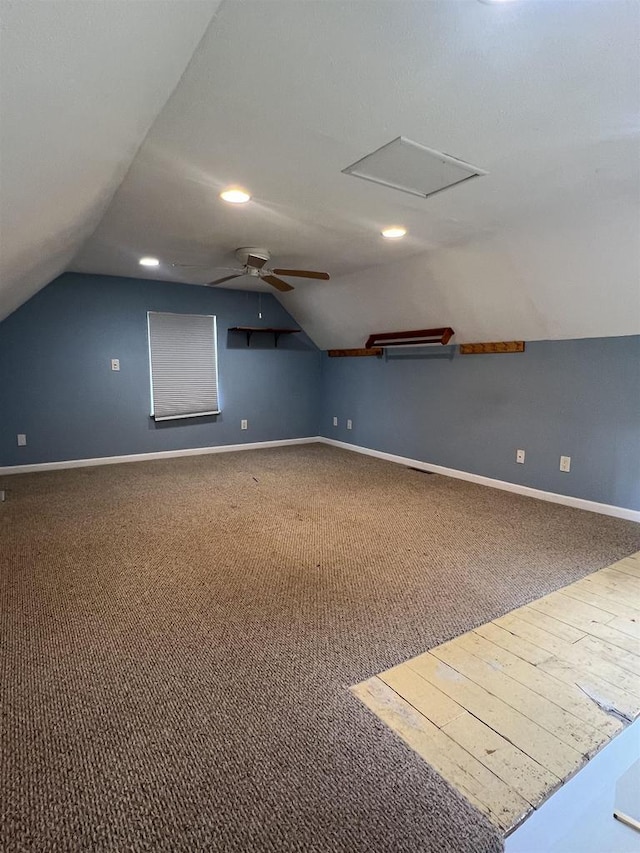 530 Wisconsin St, Columbus, WI 53925 - additional living space with vaulted ceiling, carpet floors, a ceiling fan, and attic access