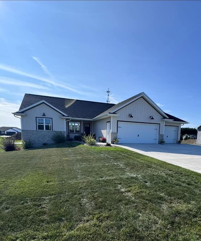117 Cortland Ave, Casco, WI 54205 - ranch-style house featuring a garage, driveway, a front yard, a shingled roof, and board and batten siding