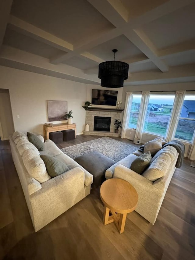 117 Cortland Ave, Casco, WI 54205 - living area featuring coffered ceiling, beamed ceiling, a fireplace, and wood finished floors