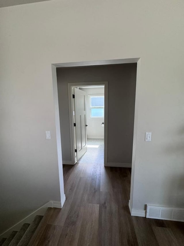 117 Cortland Ave, Casco, WI 54205 - corridor with dark wood-style flooring and baseboards