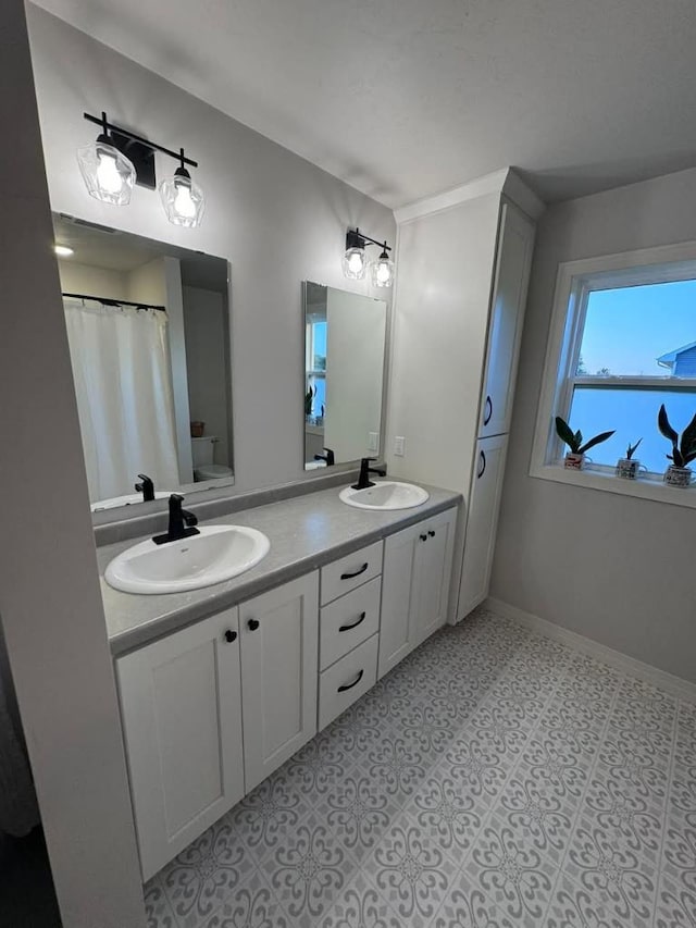 117 Cortland Ave, Casco, WI 54205 - full bathroom featuring double vanity and baseboards
