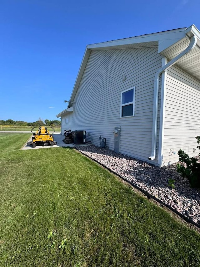 117 Cortland Ave, Casco, WI 54205 - view of side of home with a lawn and a central air condition unit