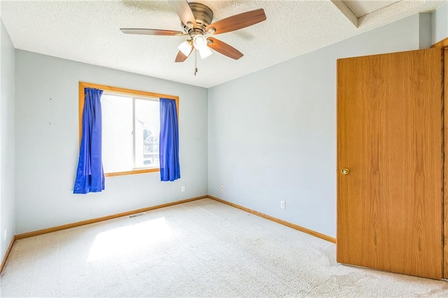 1566 Mallard Ave, Baldwin, WI 54002 - spare room featuring carpet flooring, a ceiling fan, and a textured ceiling