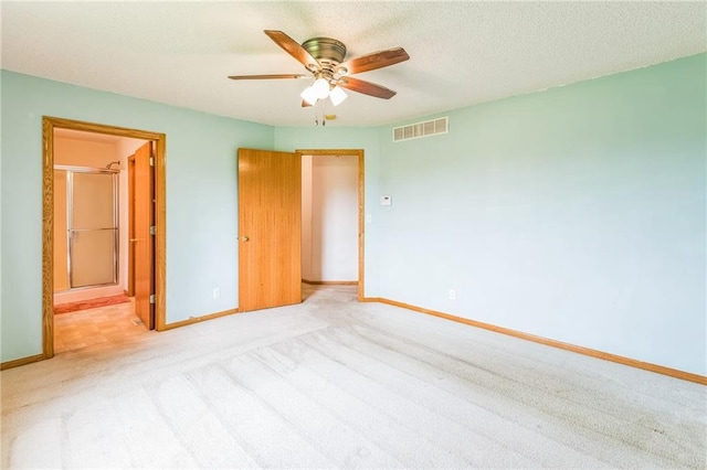 1566 Mallard Ave, Baldwin, WI 54002 - unfurnished bedroom featuring carpet floors, connected bathroom, and ceiling fan