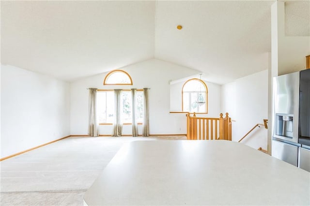 1566 Mallard Ave, Baldwin, WI 54002 - unfurnished dining area with lofted ceiling and carpet