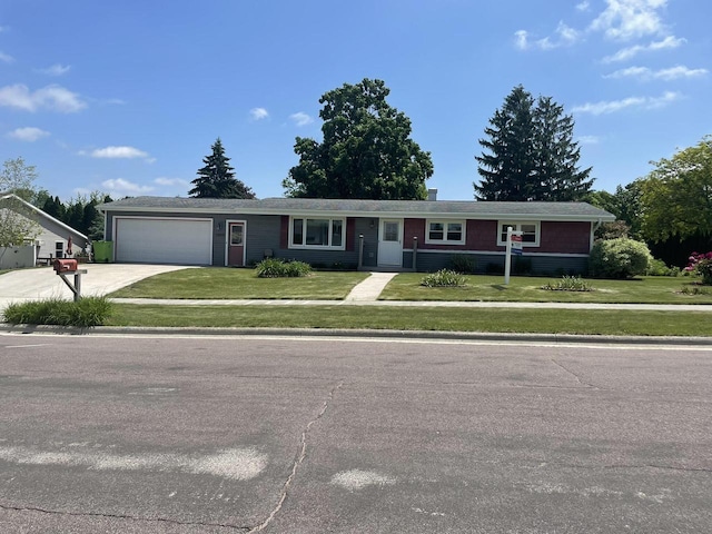 1508 Hoover St, New Holstein, WI 53061 - ranch-style house with a garage, driveway, and a front lawn