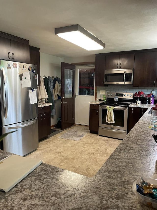 1508 Hoover St, New Holstein, WI 53061 - kitchen featuring stainless steel appliances, dark brown cabinets, and decorative backsplash