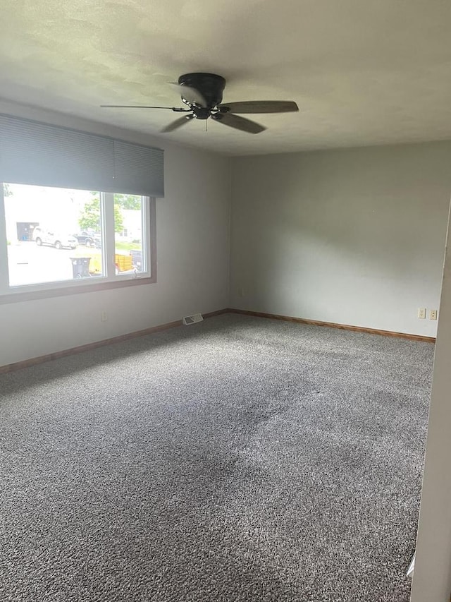 1508 Hoover St, New Holstein, WI 53061 - unfurnished room with a ceiling fan and carpet flooring