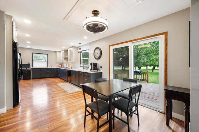 W365N7134 Mcmahon Rd, Oconomowoc, WI 53066 - dining space with light wood-type flooring and recessed lighting