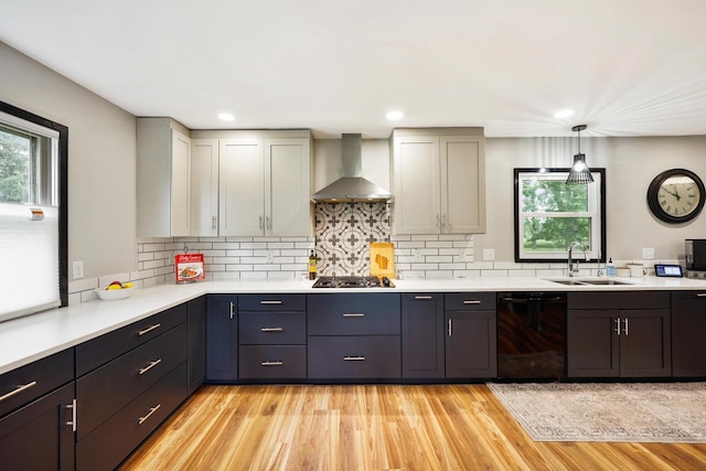 W365N7134 Mcmahon Rd, Oconomowoc, WI 53066 - kitchen featuring dishwasher, wall chimney exhaust hood, light countertops, tasteful backsplash, and recessed lighting