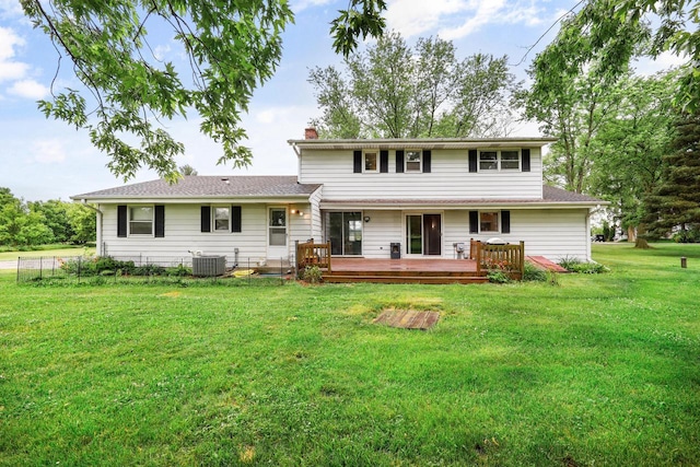 W365N7134 Mcmahon Rd, Oconomowoc, WI 53066 - rear view of house with a wooden deck, a yard, and a chimney