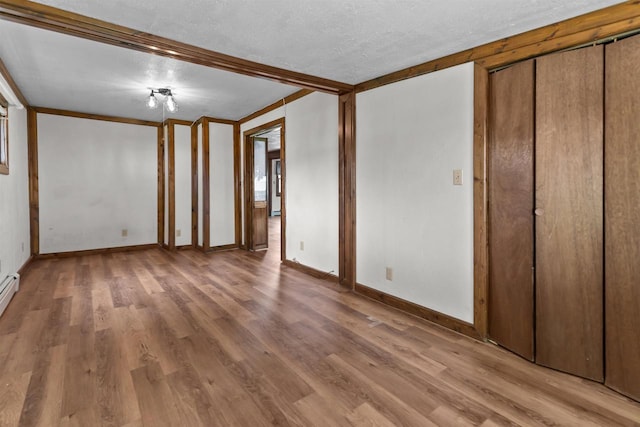 2963 Sunset Point Ln, Oshkosh, WI 54904 - unfurnished bedroom with light wood finished floors and a textured ceiling