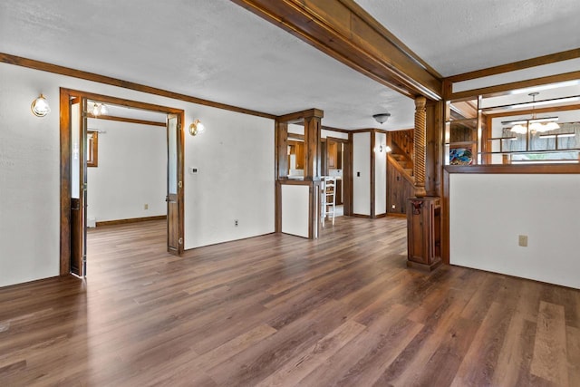 2963 Sunset Point Ln, Oshkosh, WI 54904 - empty room featuring wood finished floors, a chandelier, beam ceiling, and a textured ceiling