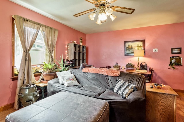 1422 S Burchard Ave, Freeport, IL 61032 - living room featuring a ceiling fan and baseboards