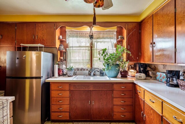 1422 S Burchard Ave, Freeport, IL 61032 - kitchen with freestanding refrigerator, open shelves, and light countertops