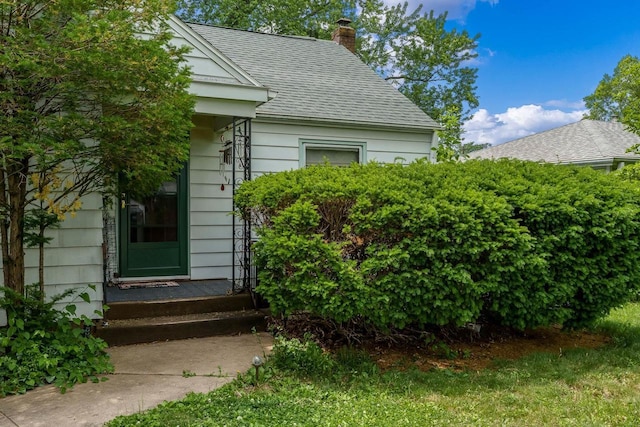 1422 S Burchard Ave, Freeport, IL 61032 - view of home's exterior with a chimney and roof with shingles