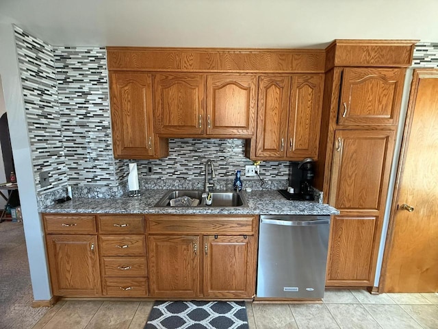 810 10th St, Monroe, WI 53566 - kitchen featuring stainless steel dishwasher, brown cabinets, and dark stone countertops
