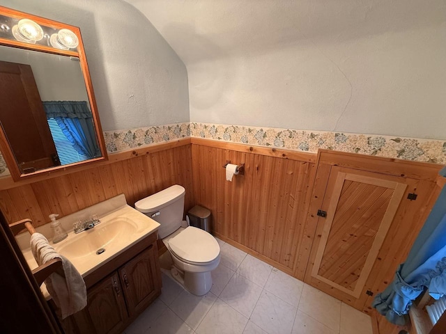 810 10th St, Monroe, WI 53566 - half bathroom featuring wainscoting, vanity, and wood walls