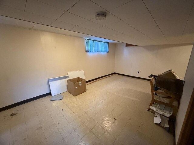 810 10th St, Monroe, WI 53566 - below grade area featuring tile patterned floors and baseboards