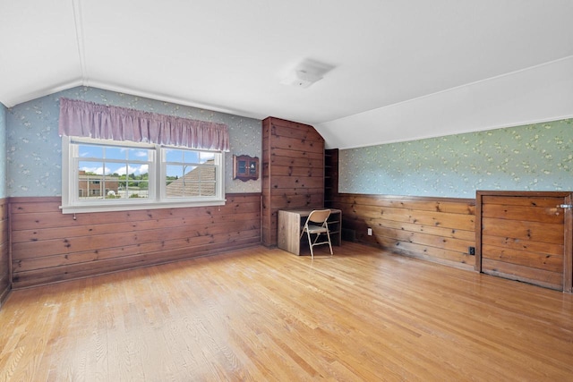 7873 N Edgeworth Dr, Milwaukee, WI 53223 - bonus room with wallpapered walls, lofted ceiling, wainscoting, and wood finished floors