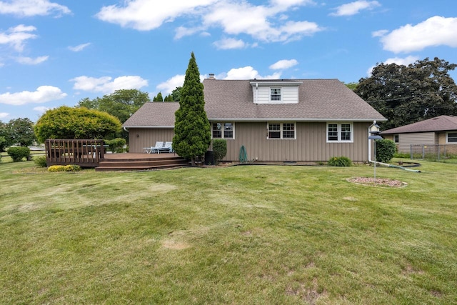 7873 N Edgeworth Dr, Milwaukee, WI 53223 - back of property featuring a deck, a chimney, and board and batten siding