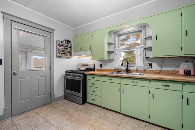 413 S Howard St, Princeton, WI 54968 - kitchen featuring gas stove, open shelves, backsplash, light tile patterned floors, and under cabinet range hood