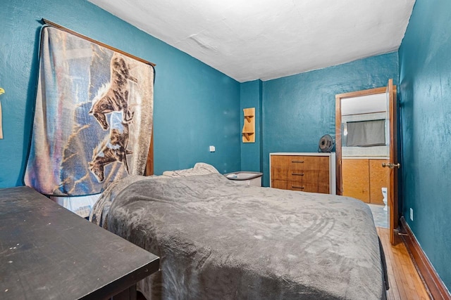 413 S Howard St, Princeton, WI 54968 - bedroom featuring hardwood / wood-style flooring and a textured wall