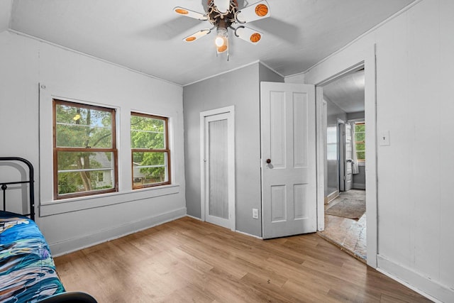 413 S Howard St, Princeton, WI 54968 - bedroom featuring wood finished floors, crown molding, and a ceiling fan