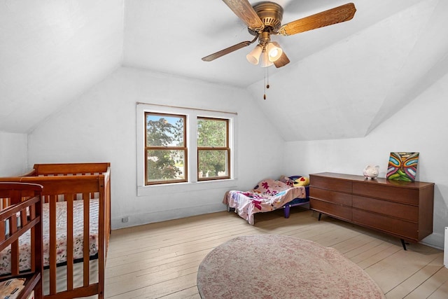 413 S Howard St, Princeton, WI 54968 - bedroom with wood-type flooring, vaulted ceiling, and ceiling fan